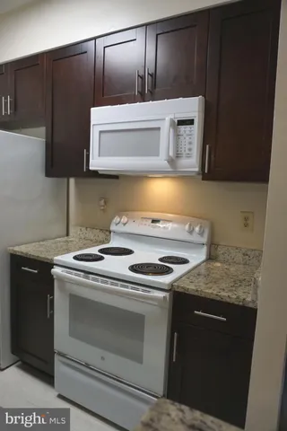 a kitchen with a stove and a microwave