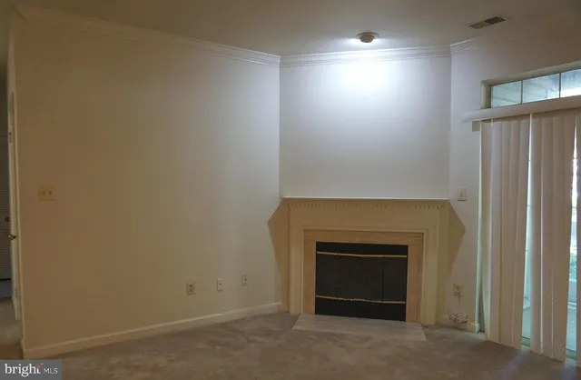 an empty room with a fireplace