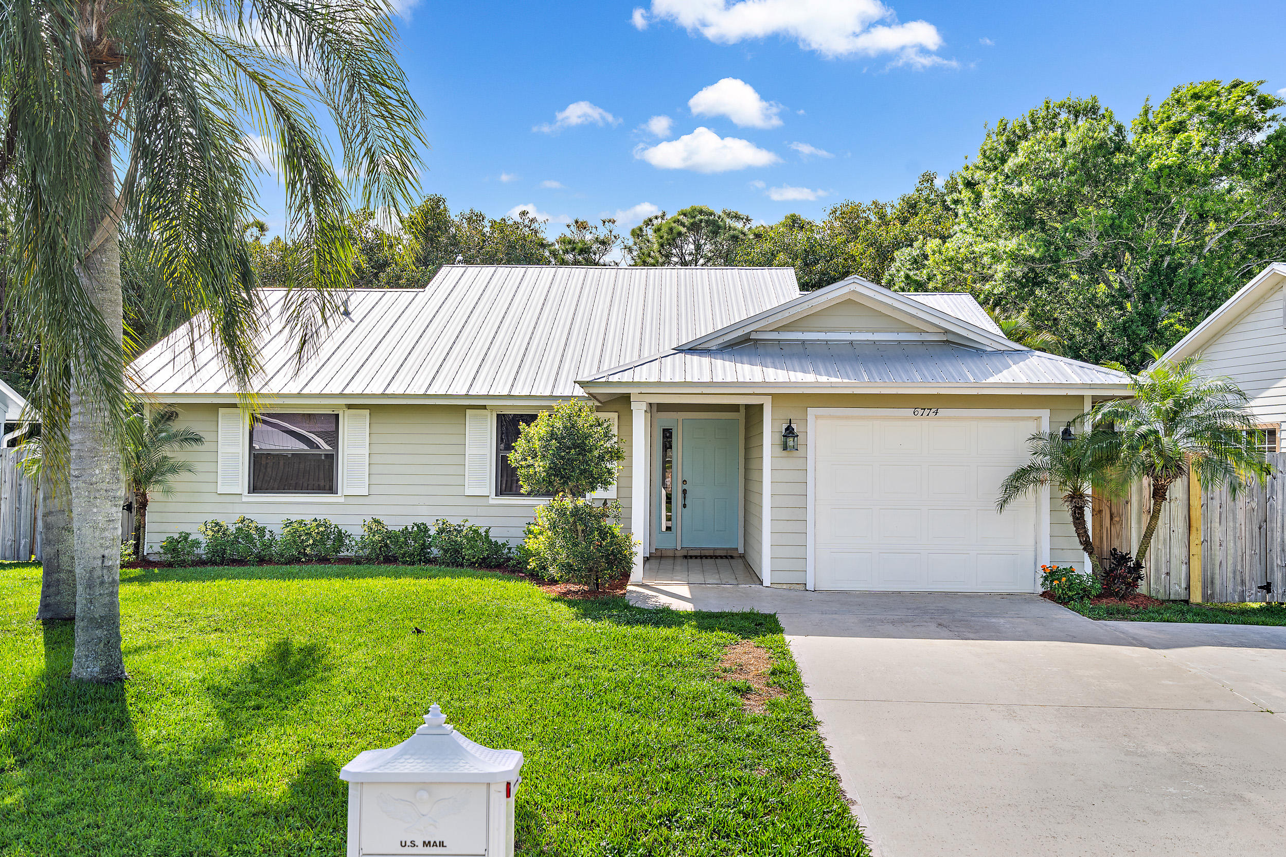 6774 Southeast Raintree Avenue Stuart, FL 34997 - Photo 1 of 25 Front Exterior