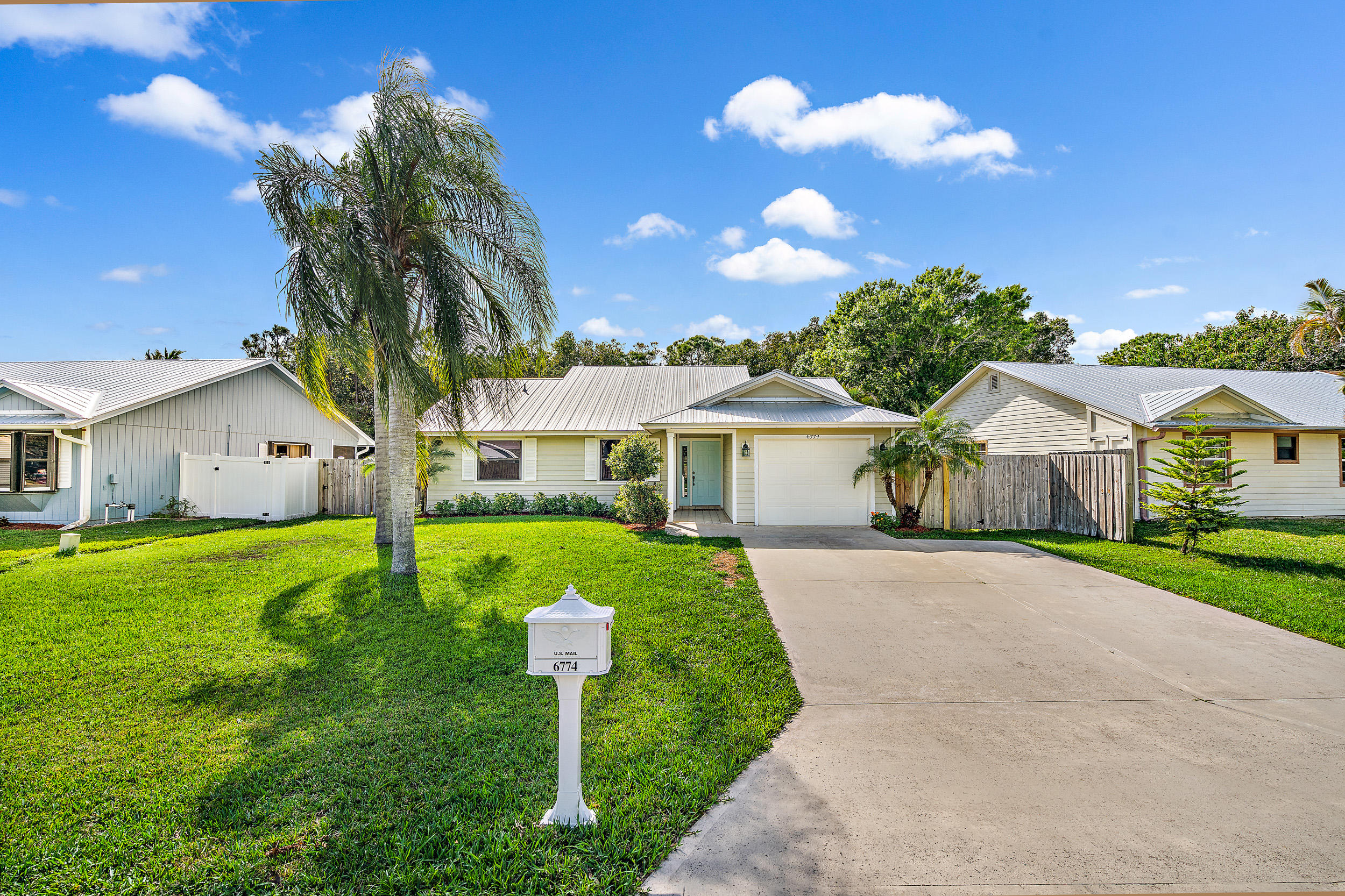 6774 Southeast Raintree Avenue Stuart, FL 34997 - Photo 2 of 25 Front Exterior