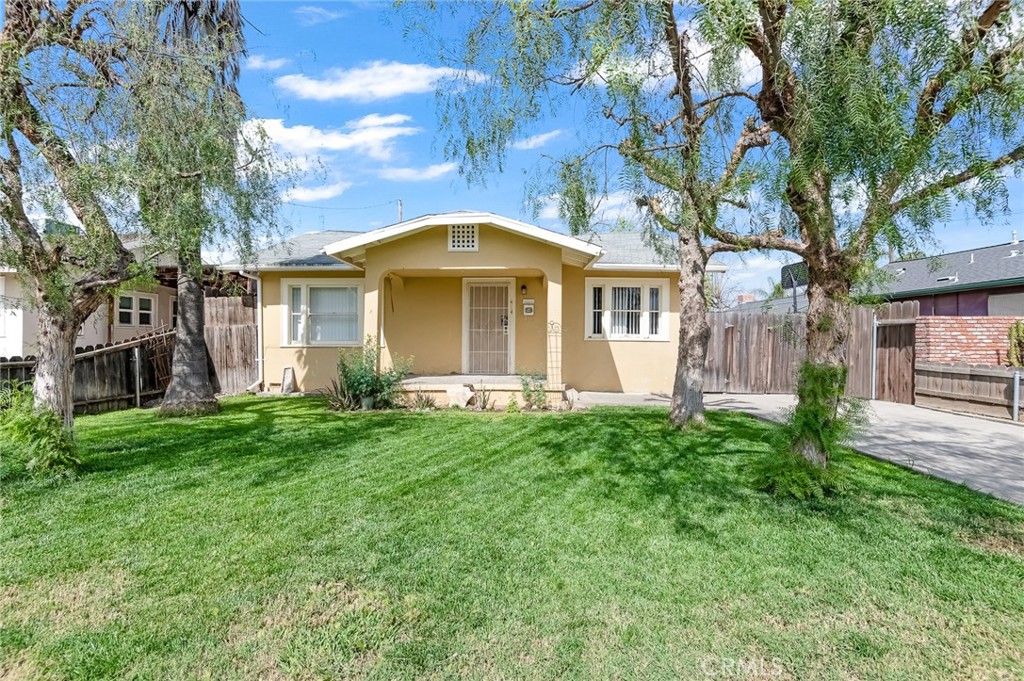 414 West Cameron Street Hanford, CA 93230 - Photo 1 of 12 a front view of a house with a garden