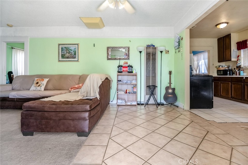 414 West Cameron Street Hanford, CA 93230 - Photo 3 of 12 a living room with furniture and a kitchen view