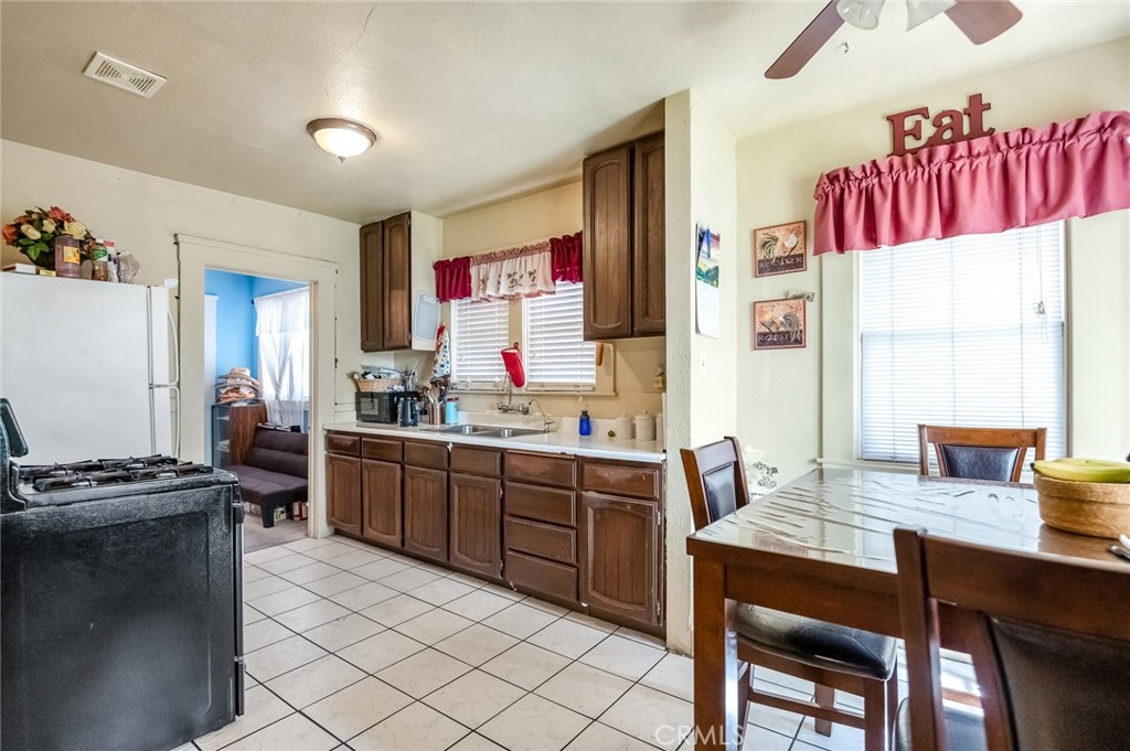 414 West Cameron Street Hanford, CA 93230 - Photo 7 of 12 a kitchen with a table and chairs in it