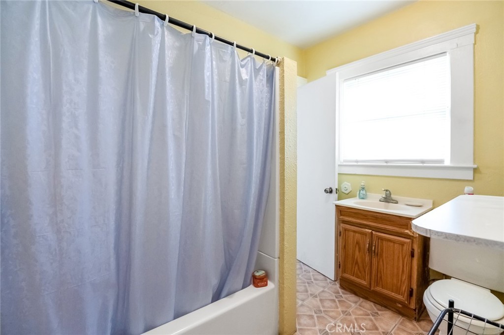 414 West Cameron Street Hanford, CA 93230 - Photo 9 of 12 a bath room with a sink and a chair