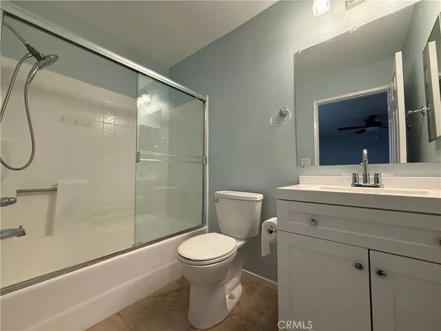 a bathroom with a toilet sink and shower