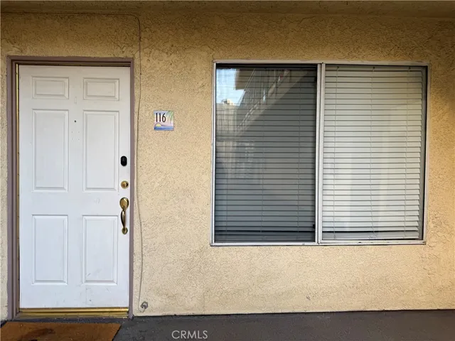 a view of a door and a window