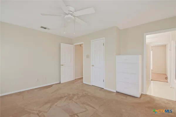 a view of a livingroom with a ceiling fan