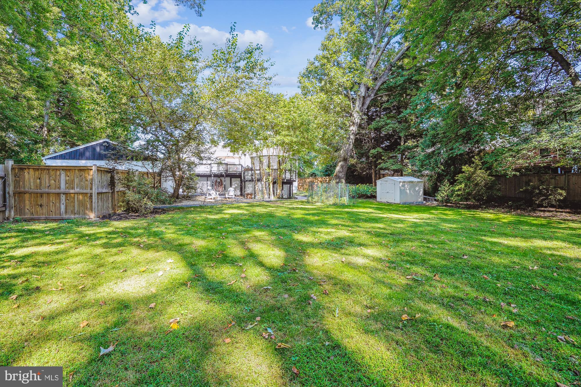 5742 Rolling Road Burke, VA 22015 - Photo 11 of 53 a view of a house with a yard and sitting area