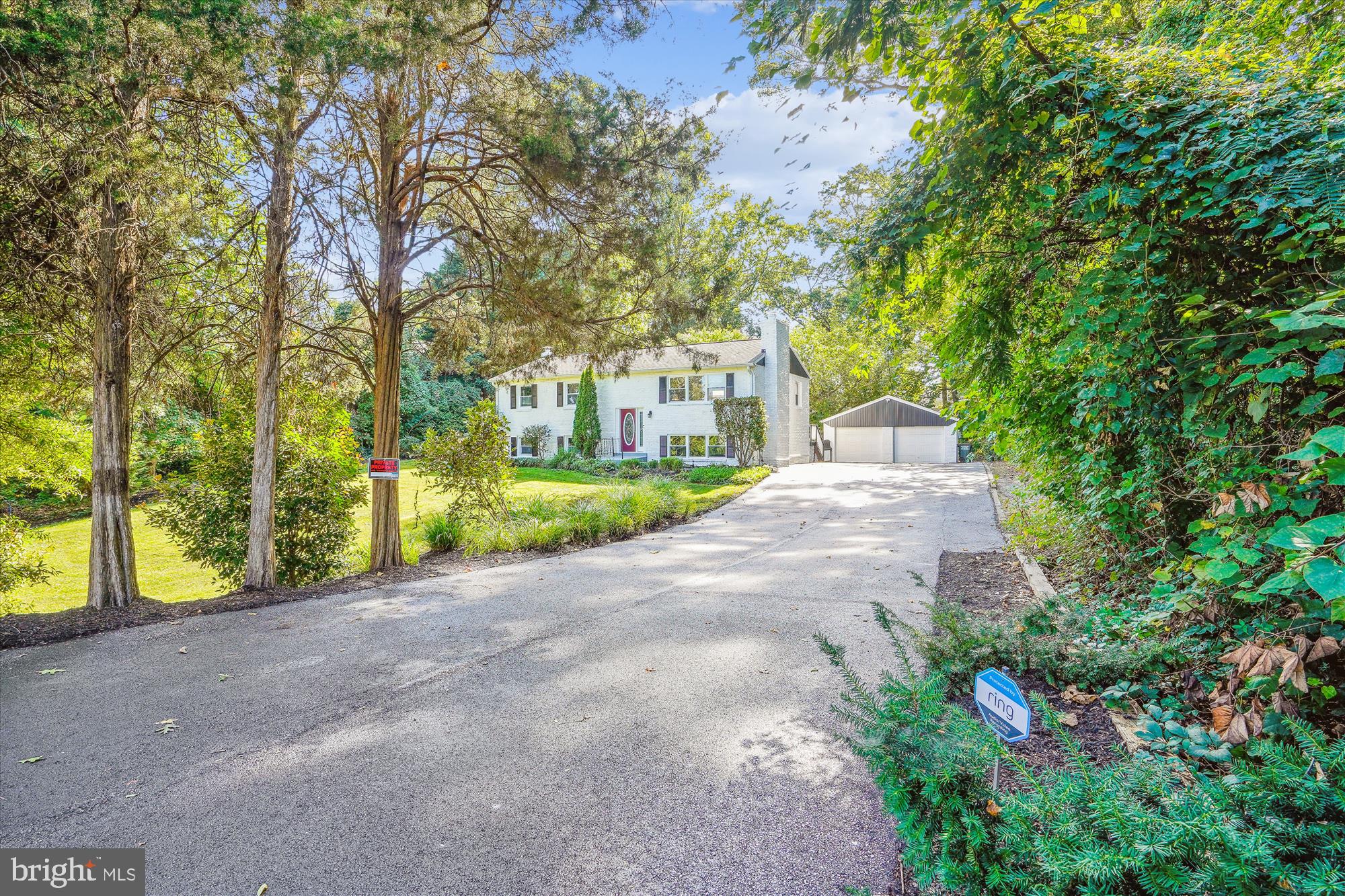 5742 Rolling Road Burke, VA 22015 - Photo 16 of 53 a view of road with large trees