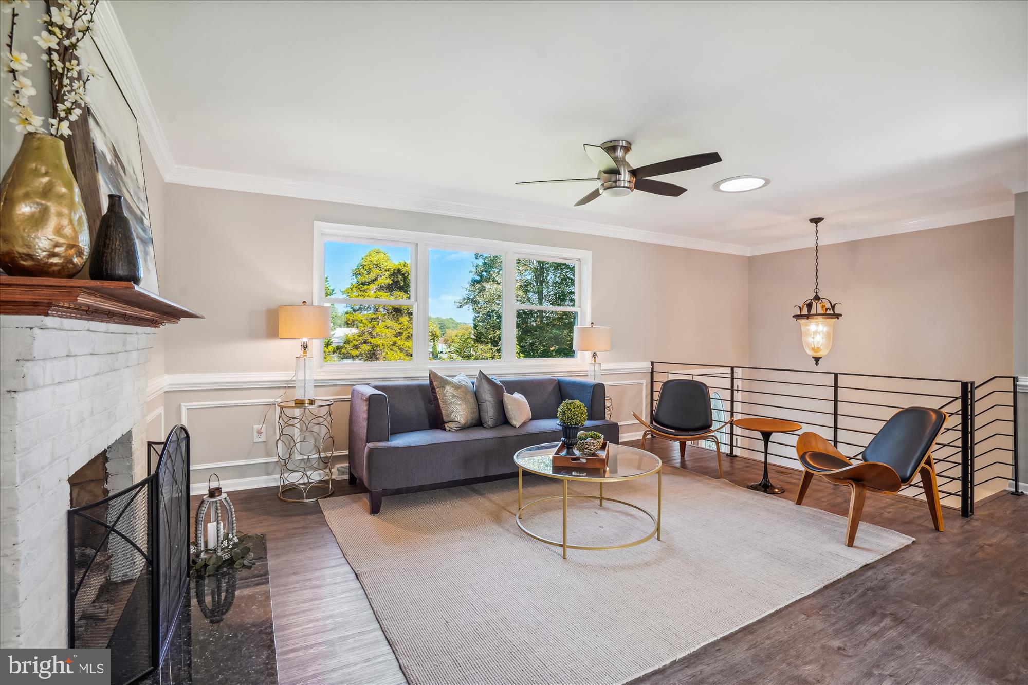 5742 Rolling Road Burke, VA 22015 - Photo 18 of 53 a living room with furniture and a fireplace