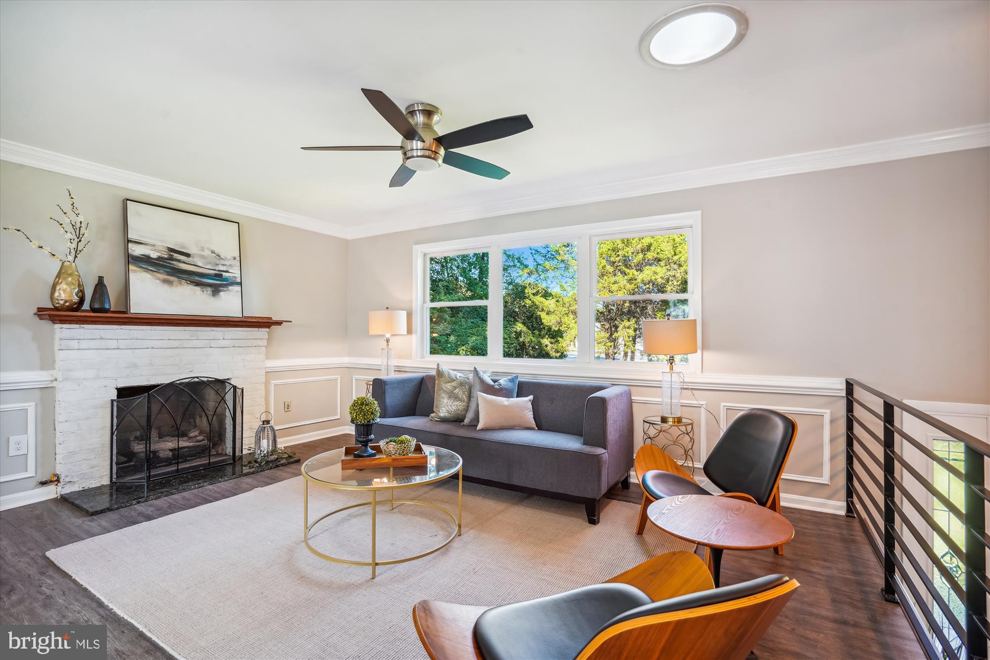 5742 Rolling Road Burke, VA 22015 - Photo 19 of 53 a living room with furniture and a fireplace