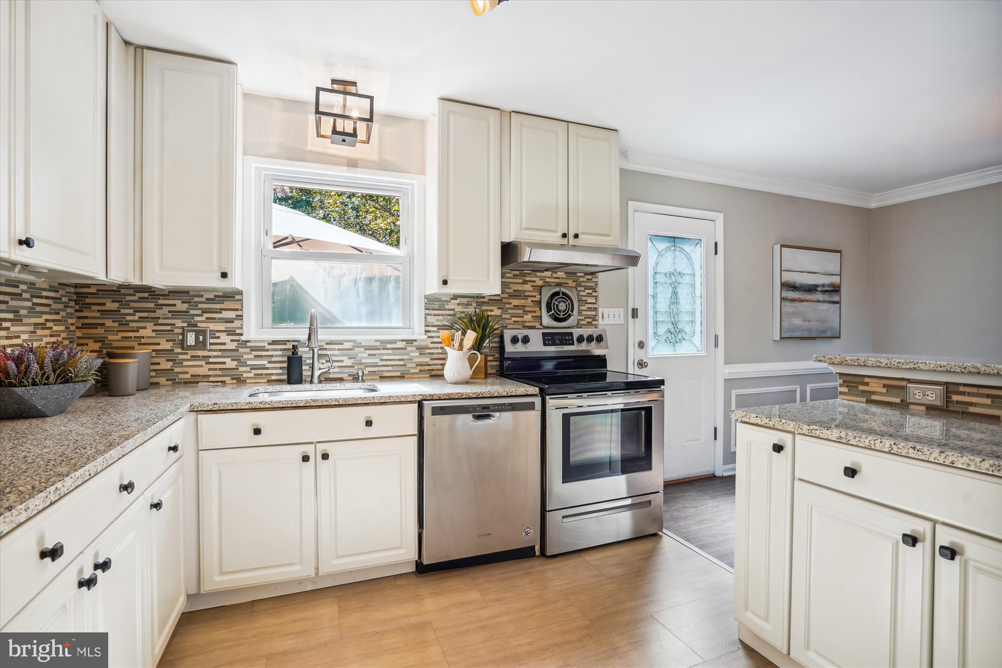 5742 Rolling Road Burke, VA 22015 - Photo 28 of 53 a kitchen with appliances a sink and cabinets