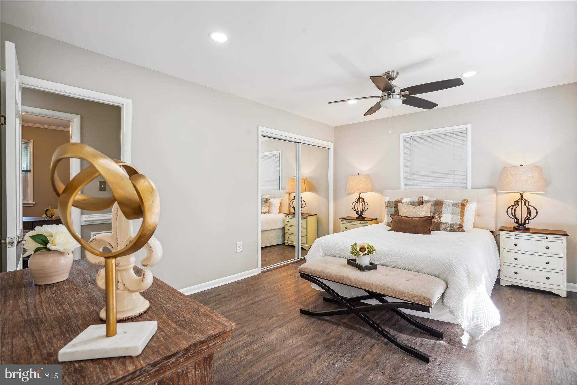 5742 Rolling Road Burke, VA 22015 - Photo 31 of 53 a bedroom with a bed and wooden floor