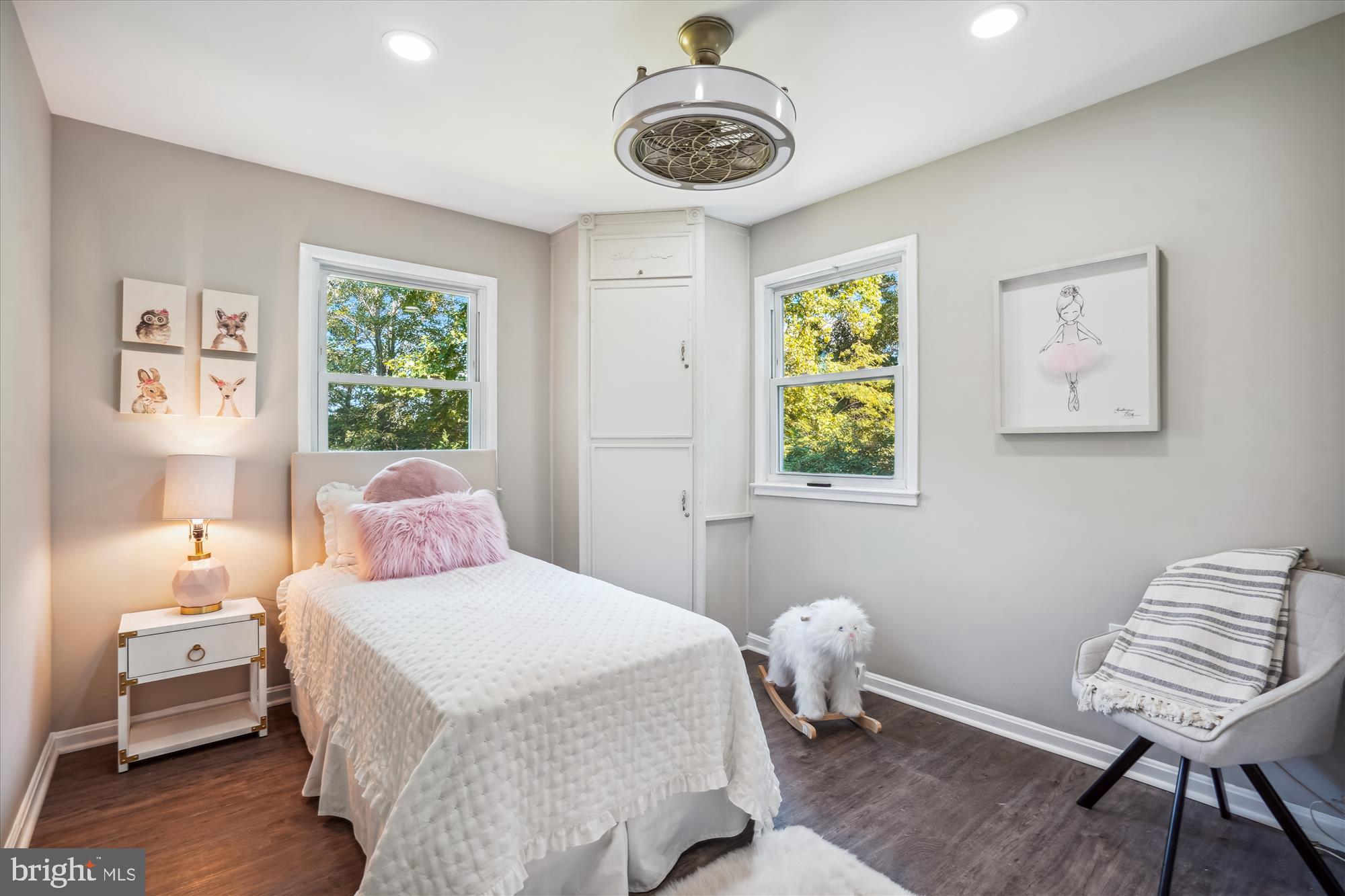 5742 Rolling Road Burke, VA 22015 - Photo 32 of 53 a bedroom with a bed and a chair