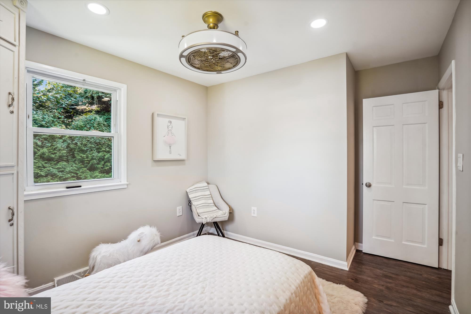 5742 Rolling Road Burke, VA 22015 - Photo 33 of 53 a bedroom with a bed and a window