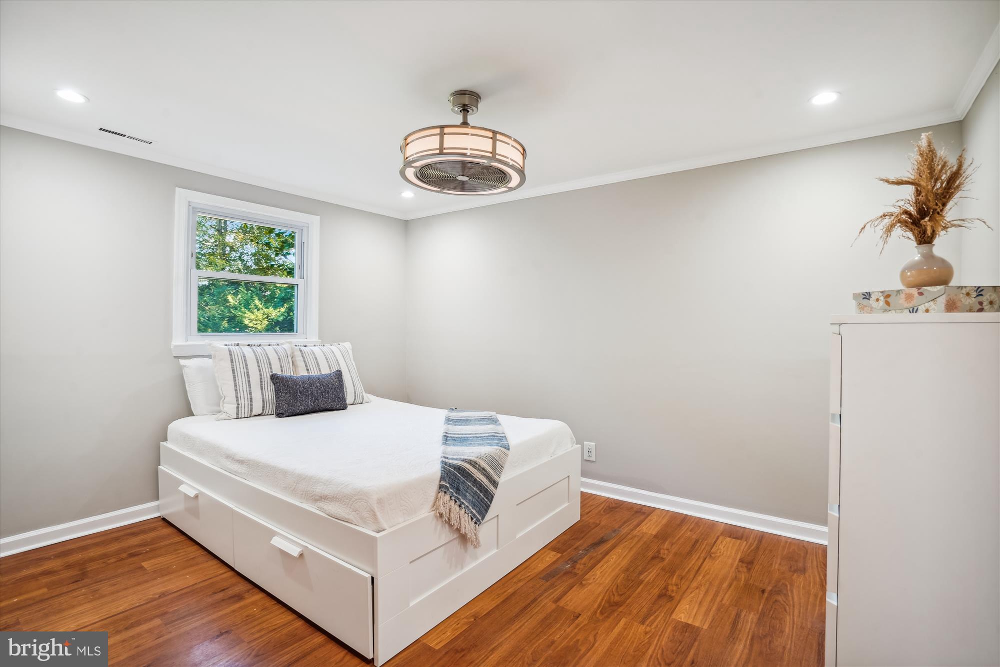 5742 Rolling Road Burke, VA 22015 - Photo 34 of 53 a bedroom with a bed and a painting on the wall