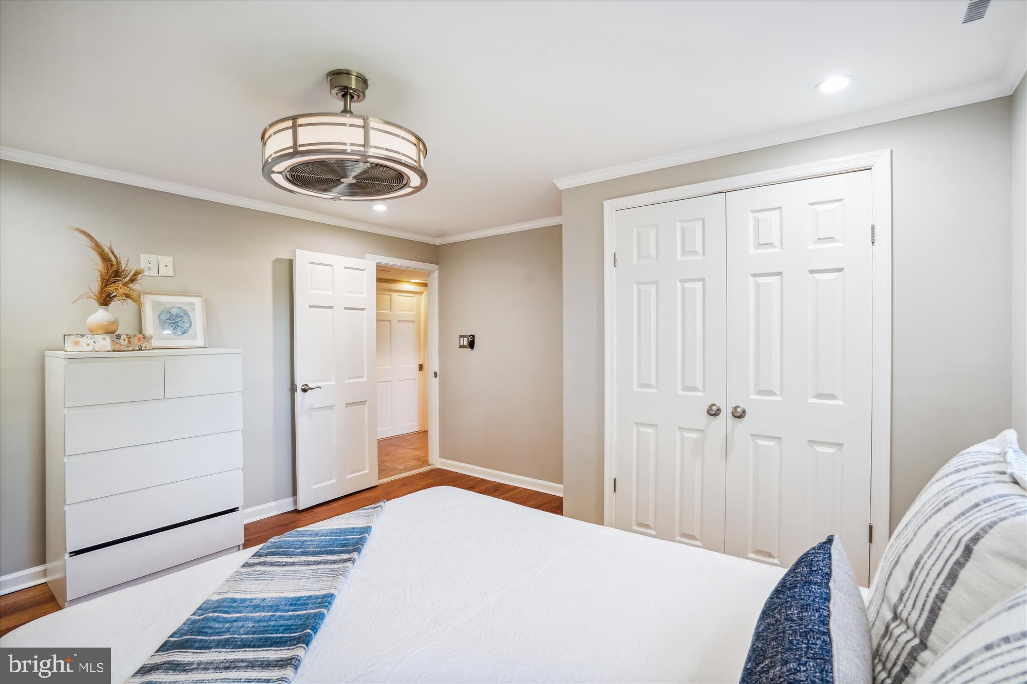 5742 Rolling Road Burke, VA 22015 - Photo 35 of 53 a bedroom with a bed and a dresser