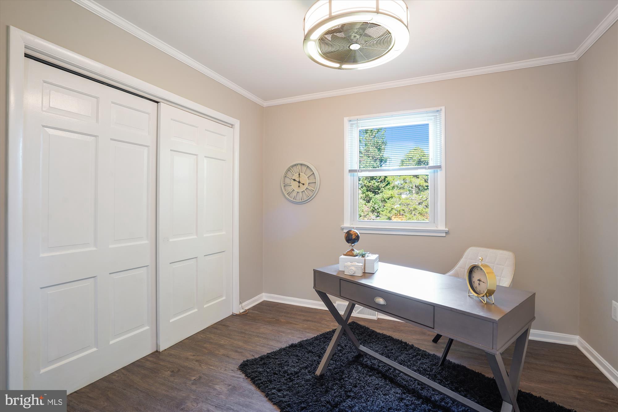 5742 Rolling Road Burke, VA 22015 - Photo 37 of 53 a dining room with wooden floor and a window