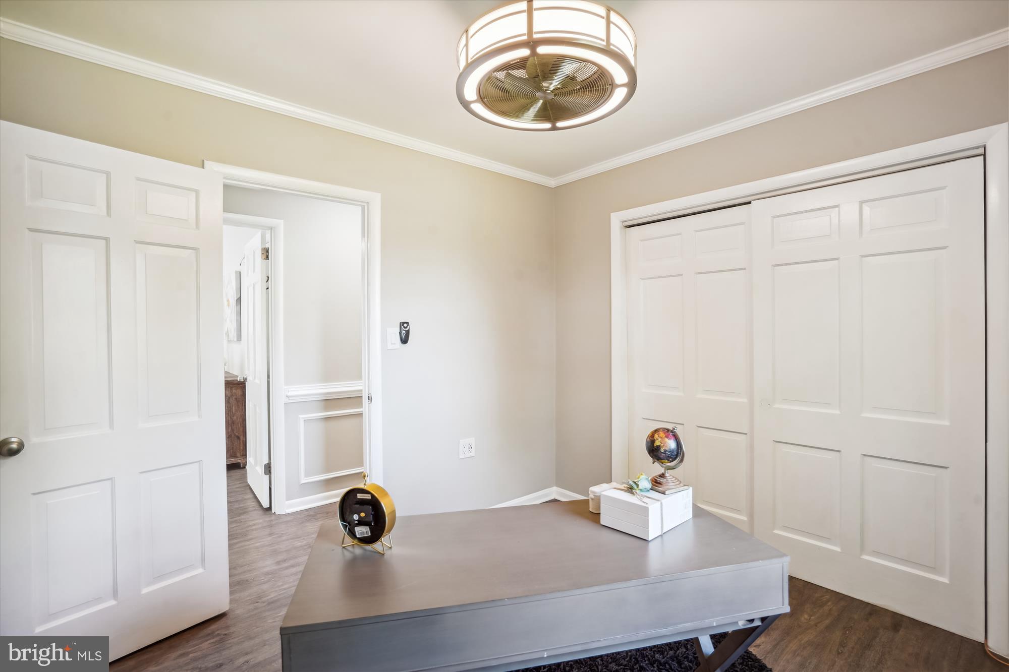 5742 Rolling Road Burke, VA 22015 - Photo 38 of 53 a view of a room that has a table and chair