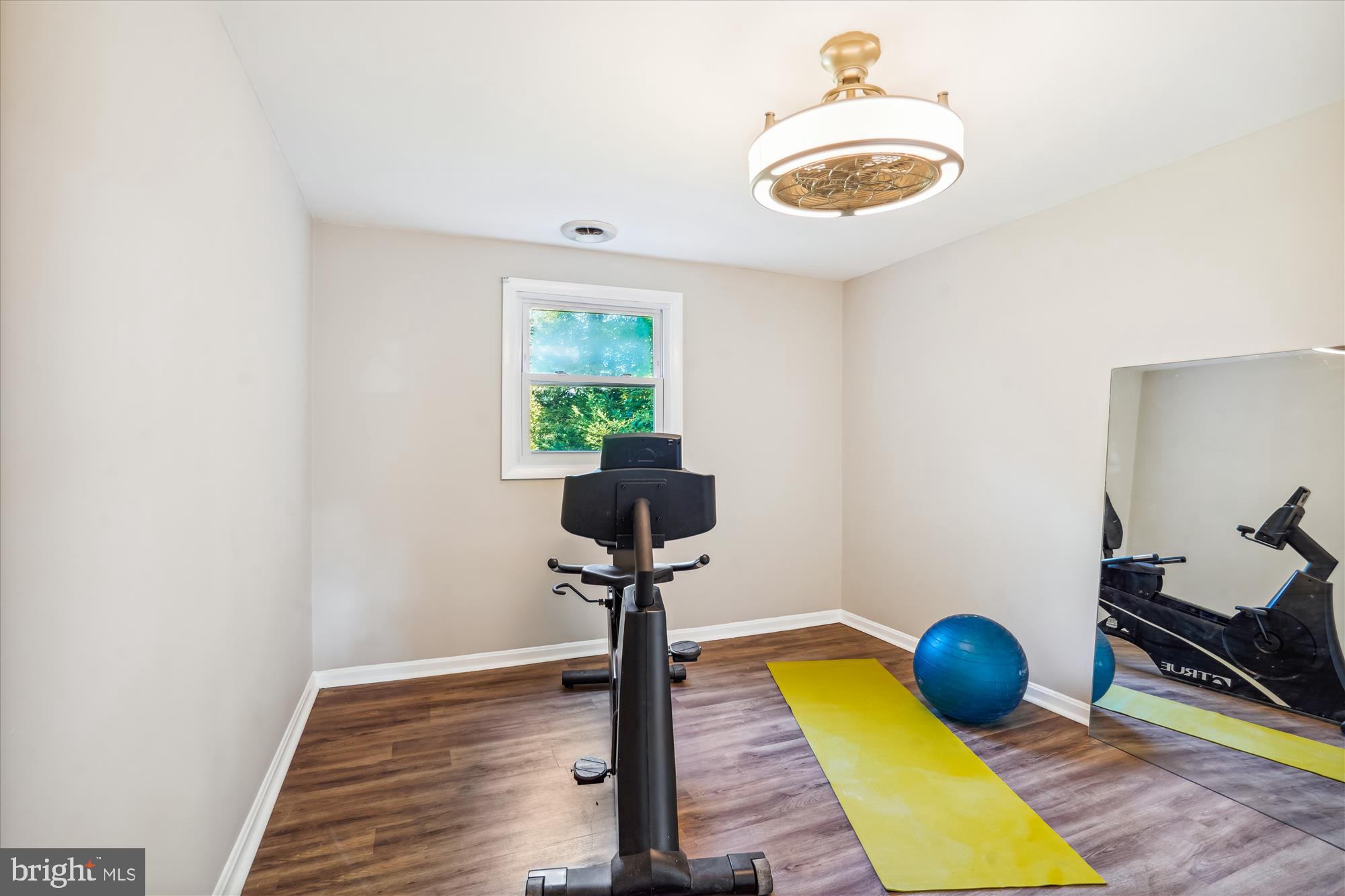 5742 Rolling Road Burke, VA 22015 - Photo 39 of 53 a room with furniture and a potted plant