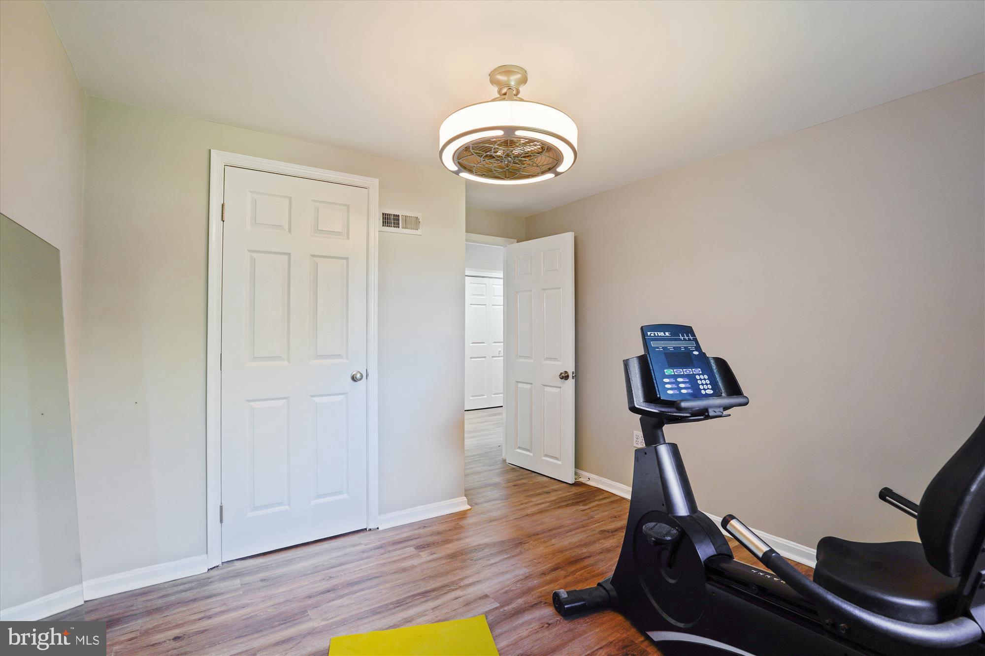 5742 Rolling Road Burke, VA 22015 - Photo 40 of 53 a room with gym equipment