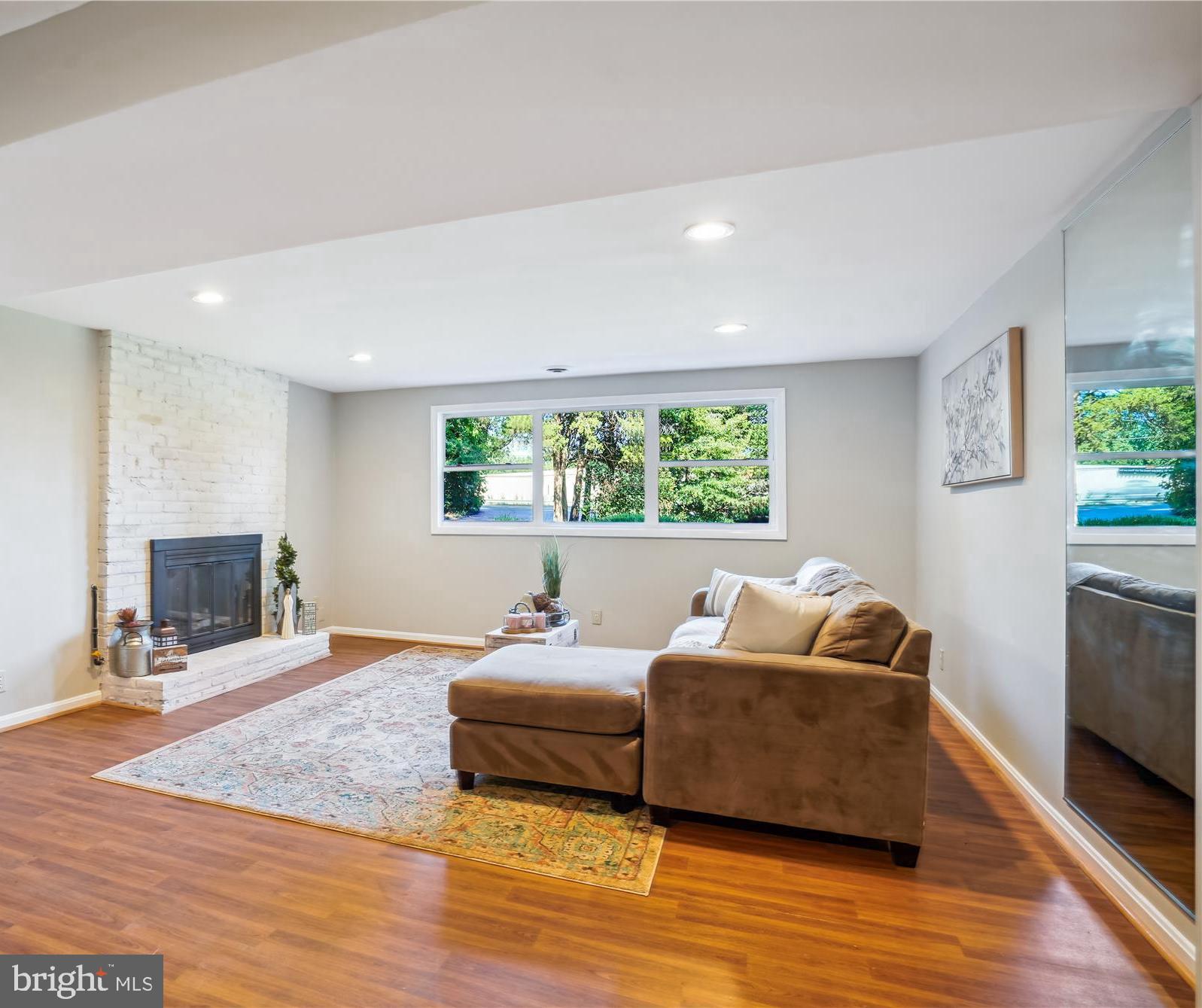 5742 Rolling Road Burke, VA 22015 - Photo 41 of 53 a bedroom with furniture and a flat screen tv