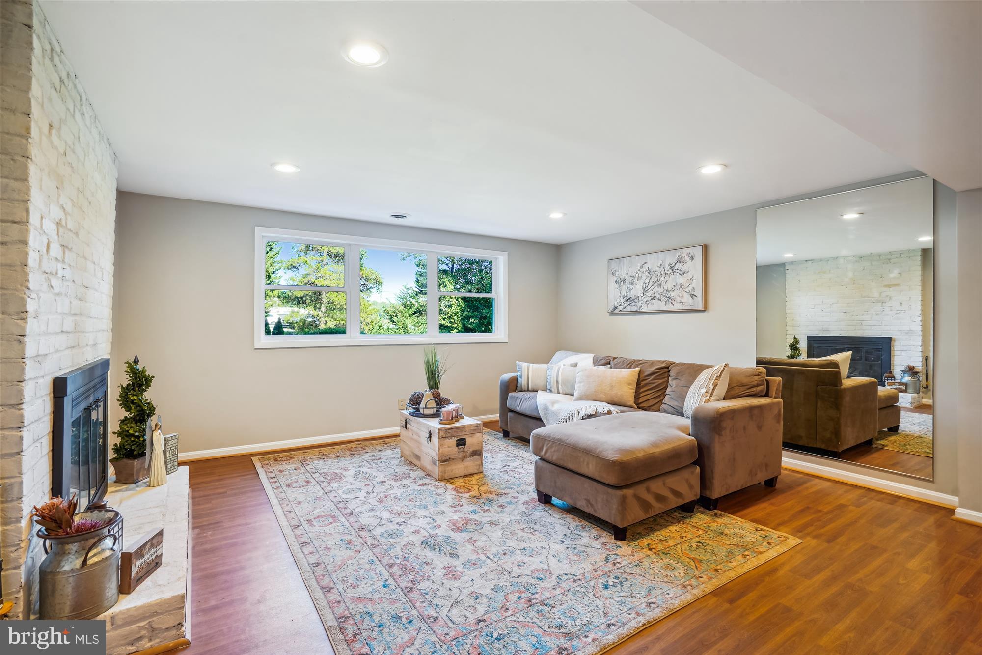 5742 Rolling Road Burke, VA 22015 - Photo 42 of 53 a living room with furniture and a window