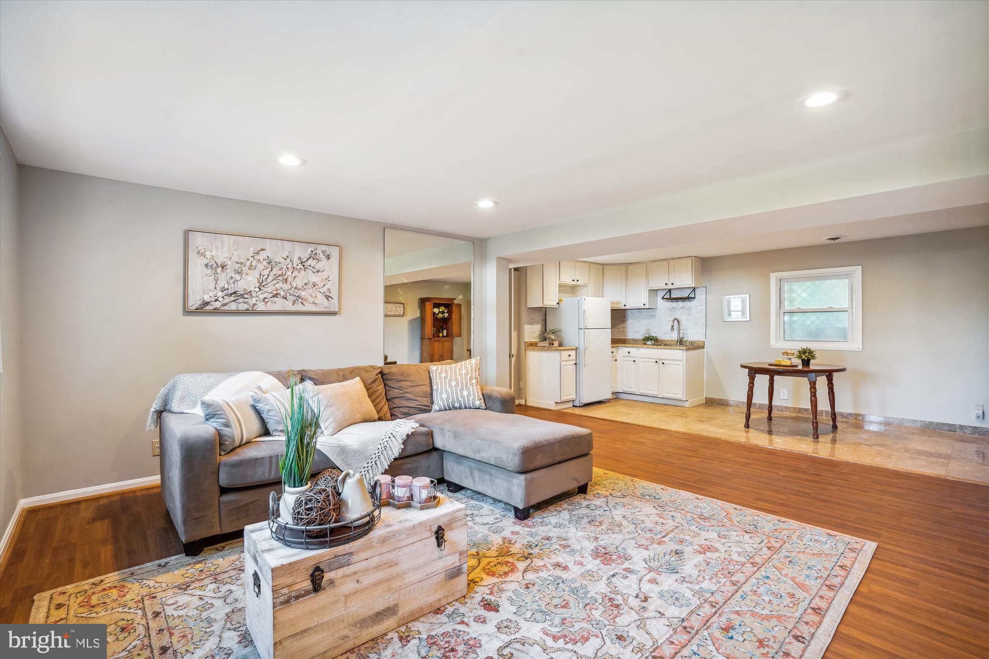 5742 Rolling Road Burke, VA 22015 - Photo 43 of 53 a living room with furniture and a rug