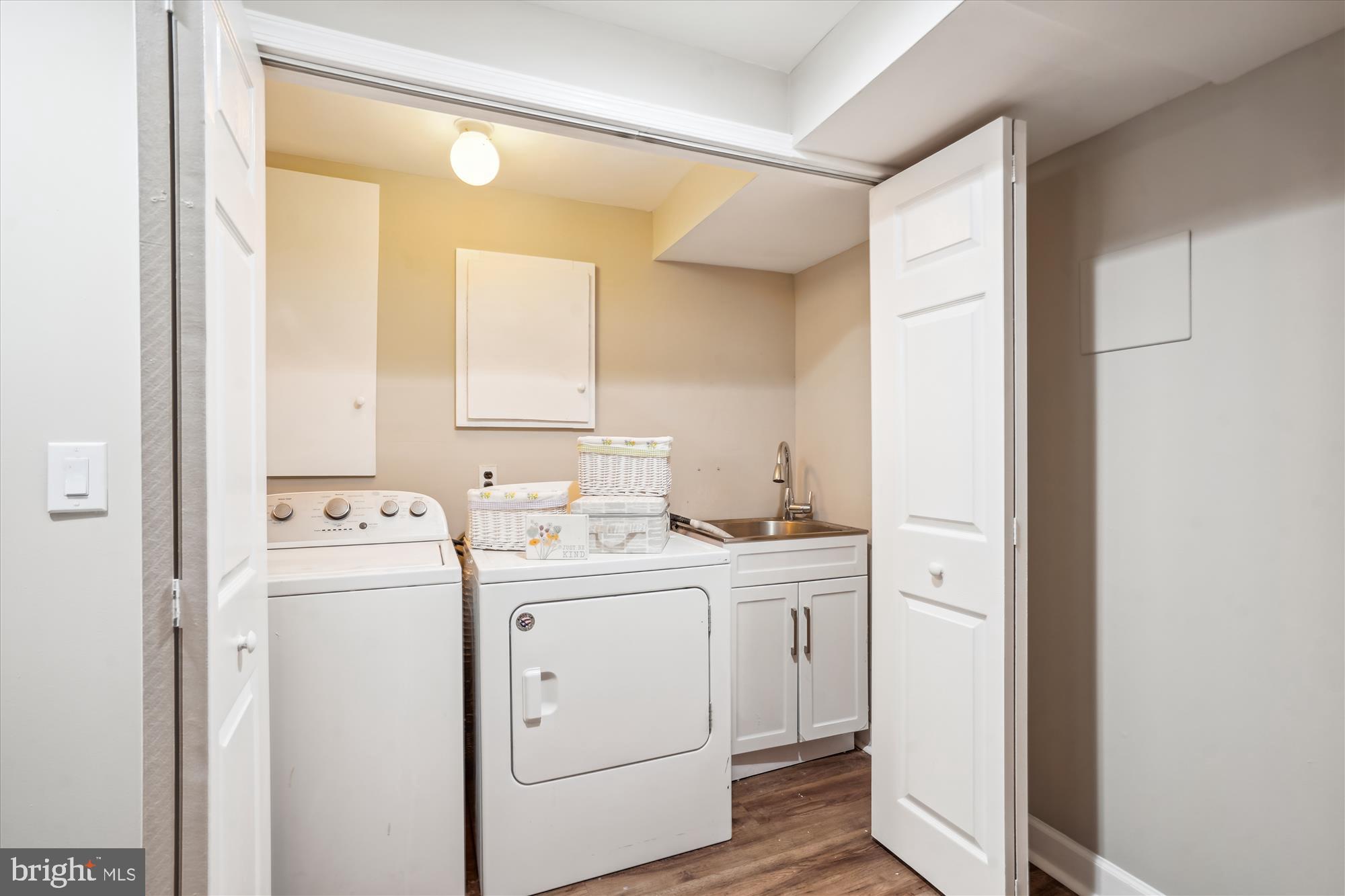 5742 Rolling Road Burke, VA 22015 - Photo 47 of 53 a view of washer and dryer with bathroom in the background
