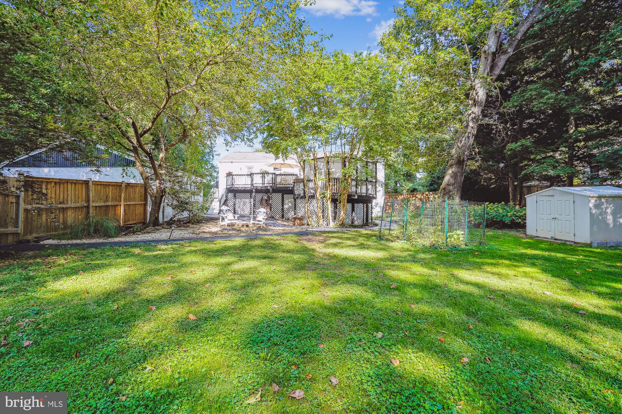 5742 Rolling Road Burke, VA 22015 - Photo 9 of 53 a view of a house with a backyard and a patio