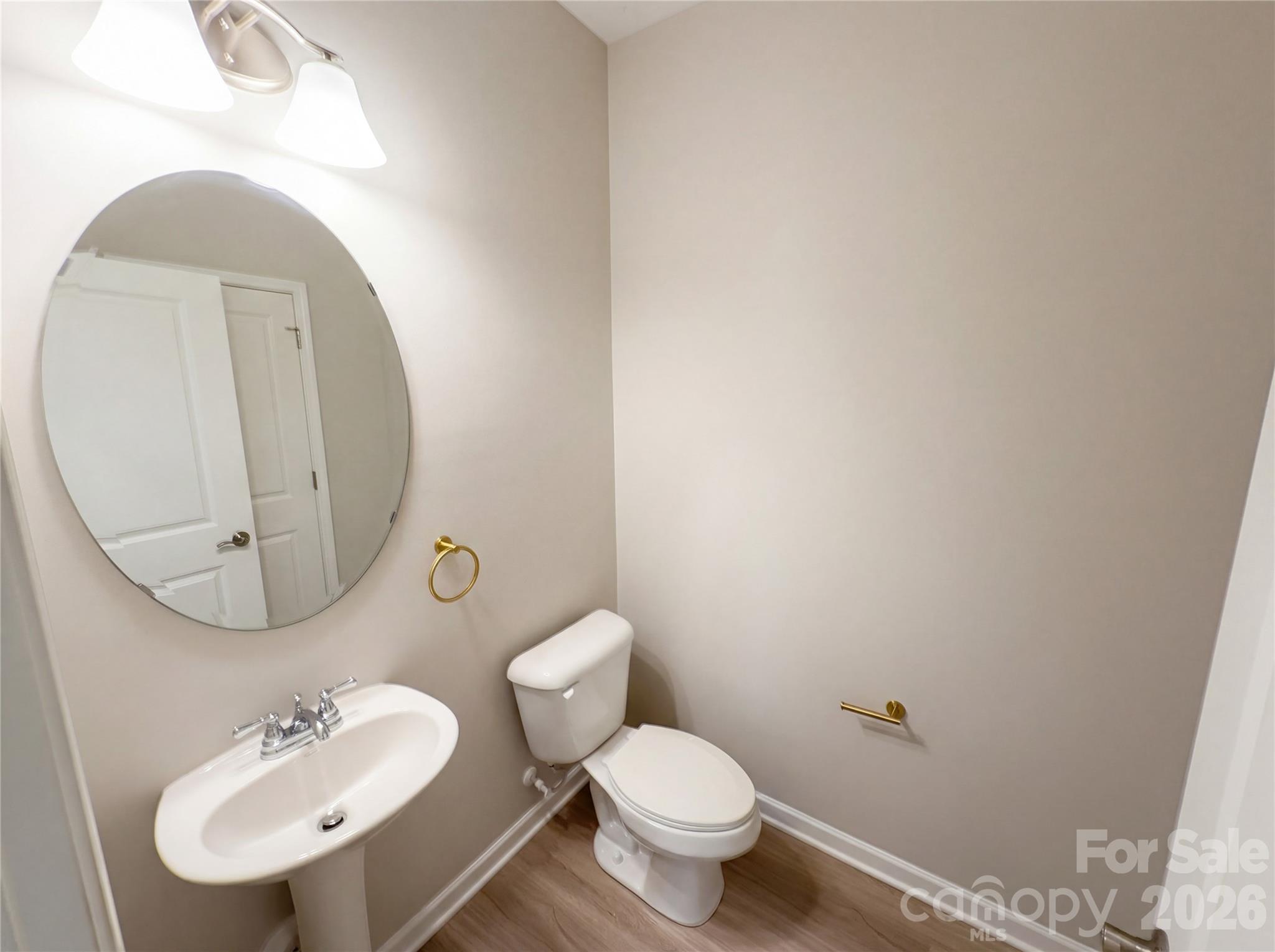 617 Ardsley Drive Locust, NC 28097 - Photo 16 of 23 a bathroom with a toilet sink and mirror