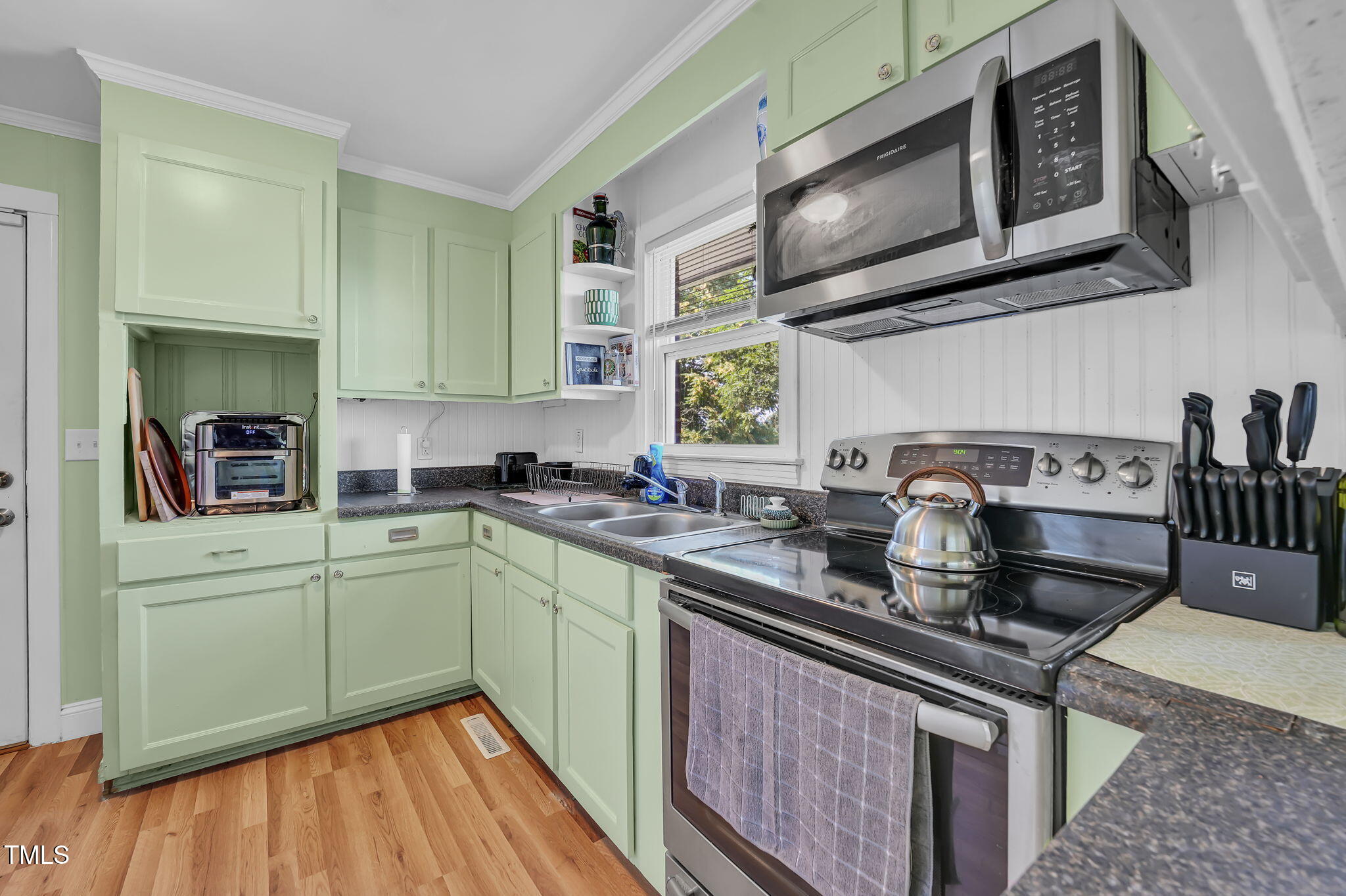 483 Allison Road Ruffin, NC 27326 - Photo 10 of 36 a kitchen with stainless steel appliances granite countertop a sink stove and cabinets