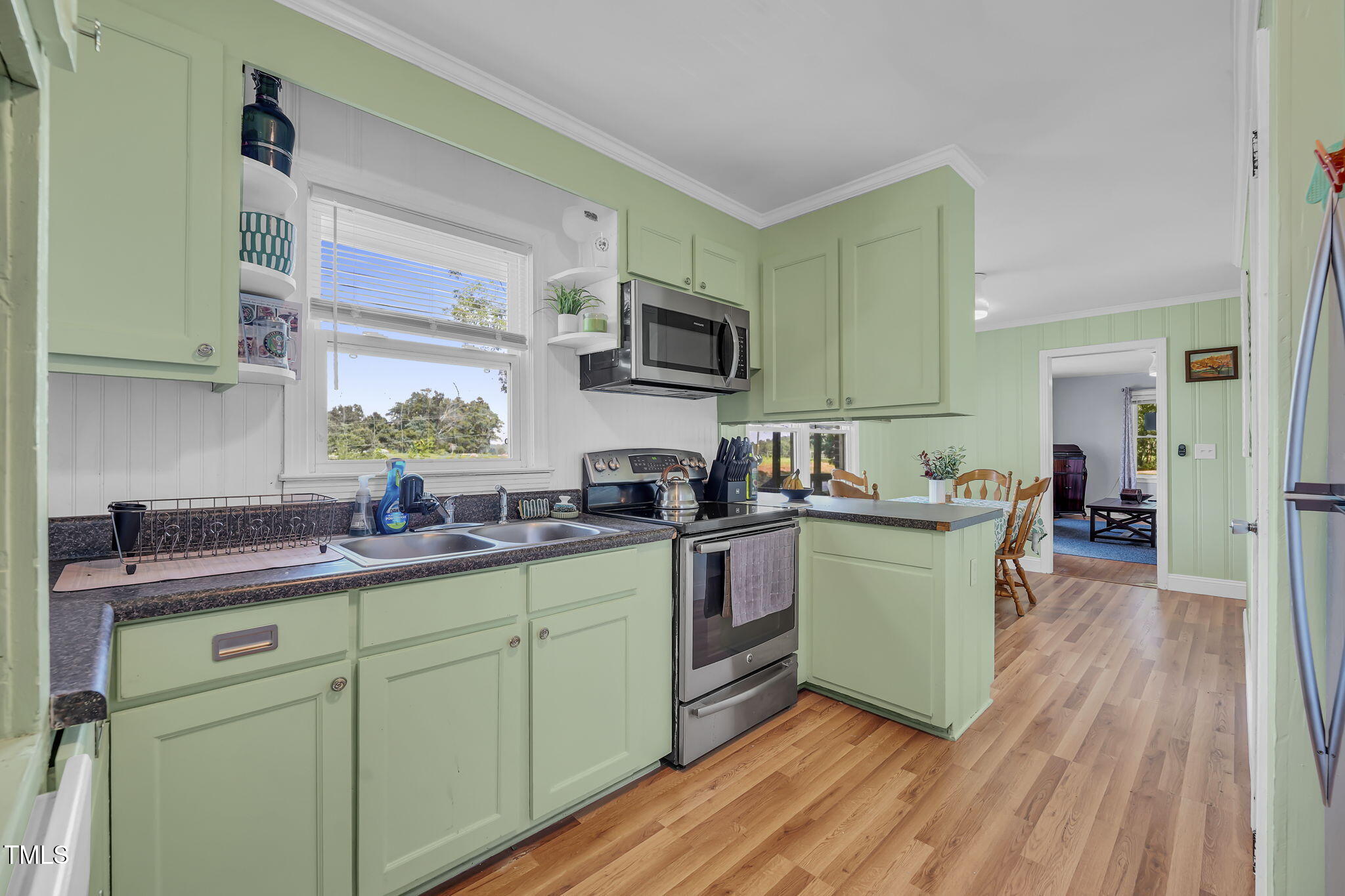 483 Allison Road Ruffin, NC 27326 - Photo 11 of 36 a kitchen with a sink cabinets and wooden floor