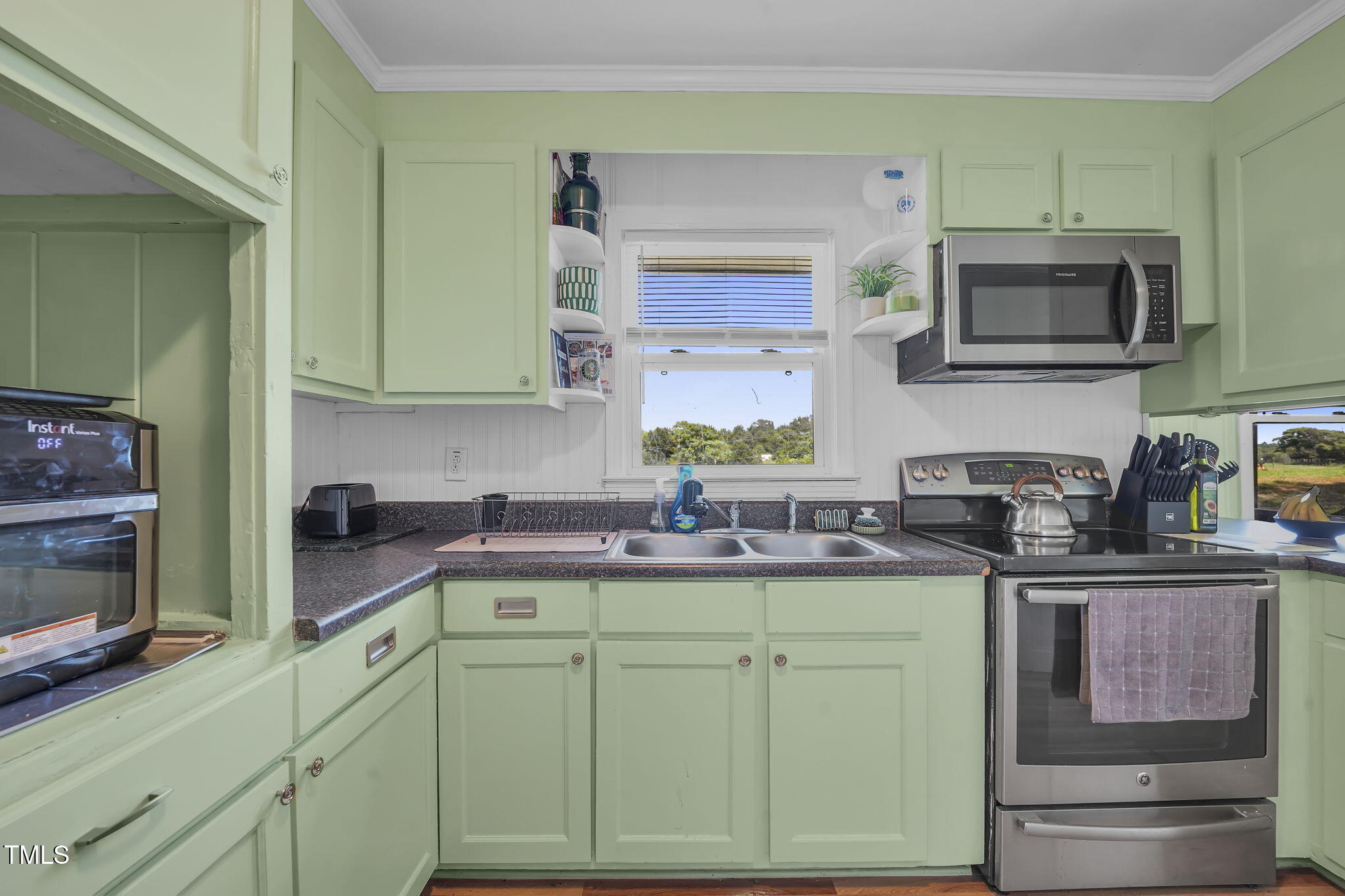 483 Allison Road Ruffin, NC 27326 - Photo 12 of 36 a kitchen with stainless steel appliances granite countertop a sink and cabinets