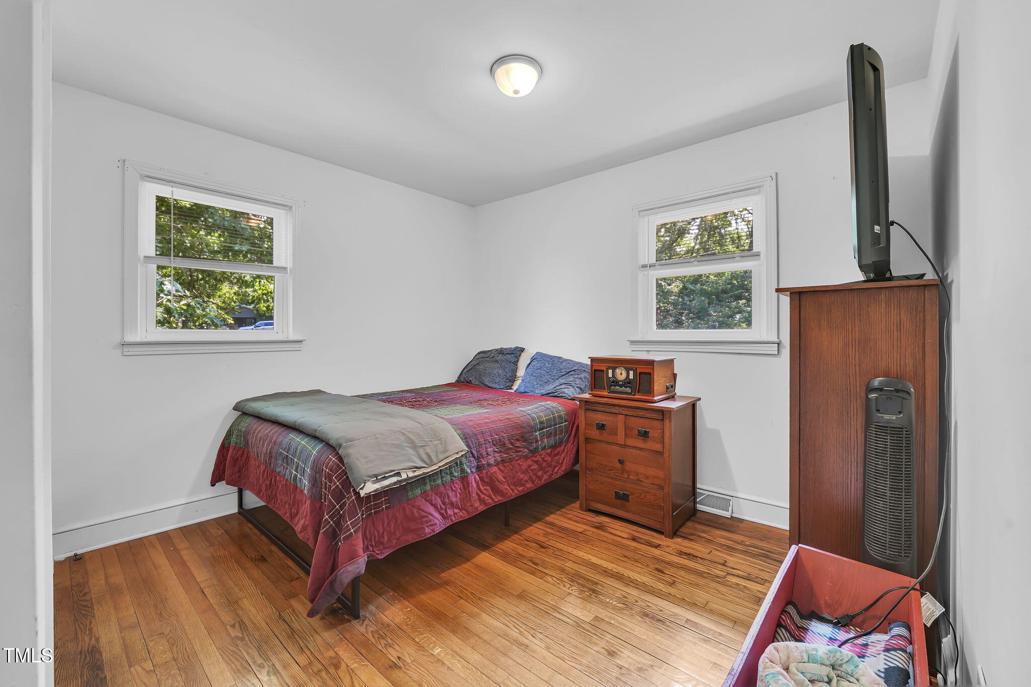 483 Allison Road Ruffin, NC 27326 - Photo 16 of 36 a bedroom with a bed and wooden floor