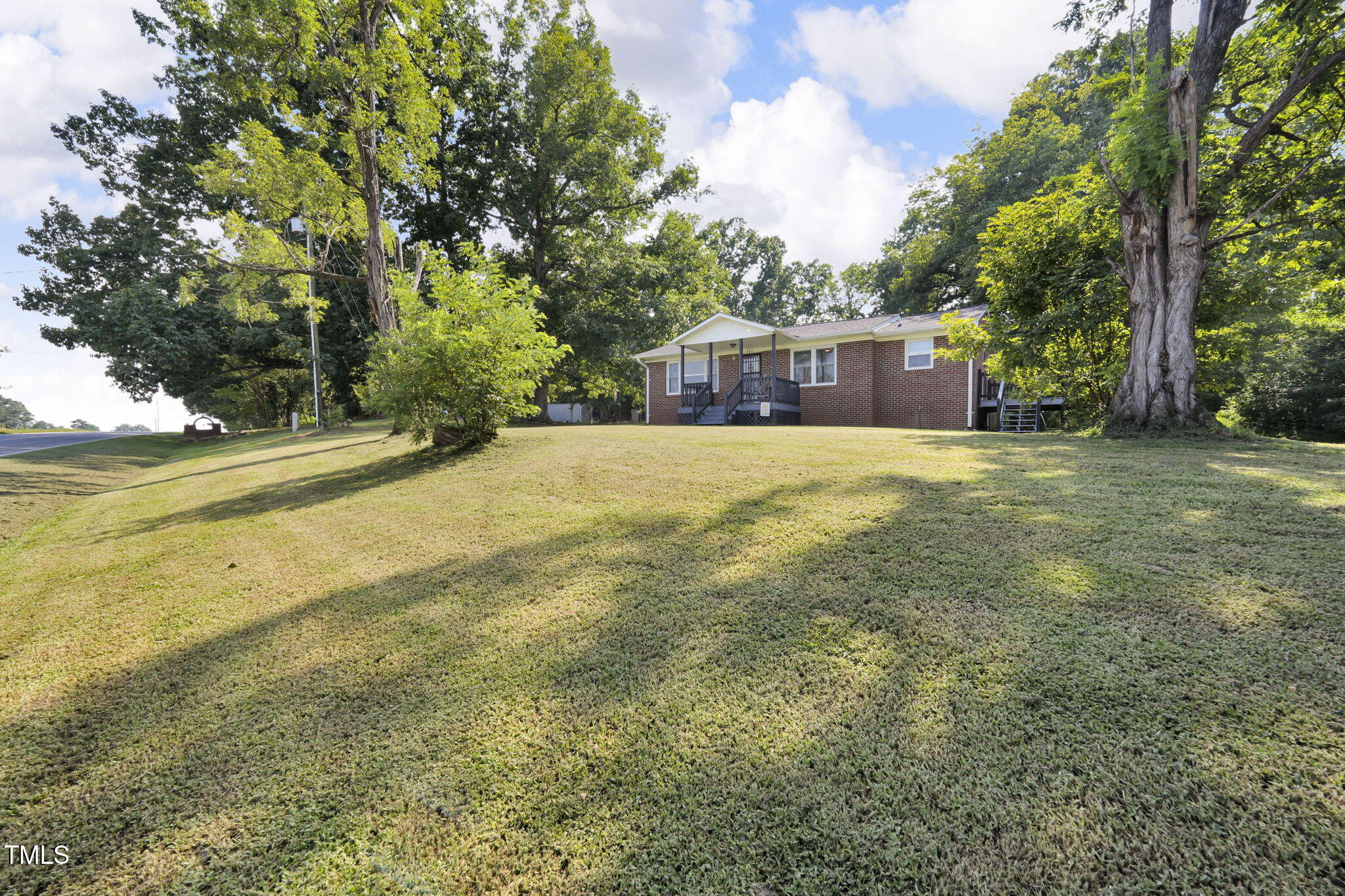 483 Allison Road Ruffin, NC 27326 - Photo 30 of 36 a house with trees in front of it