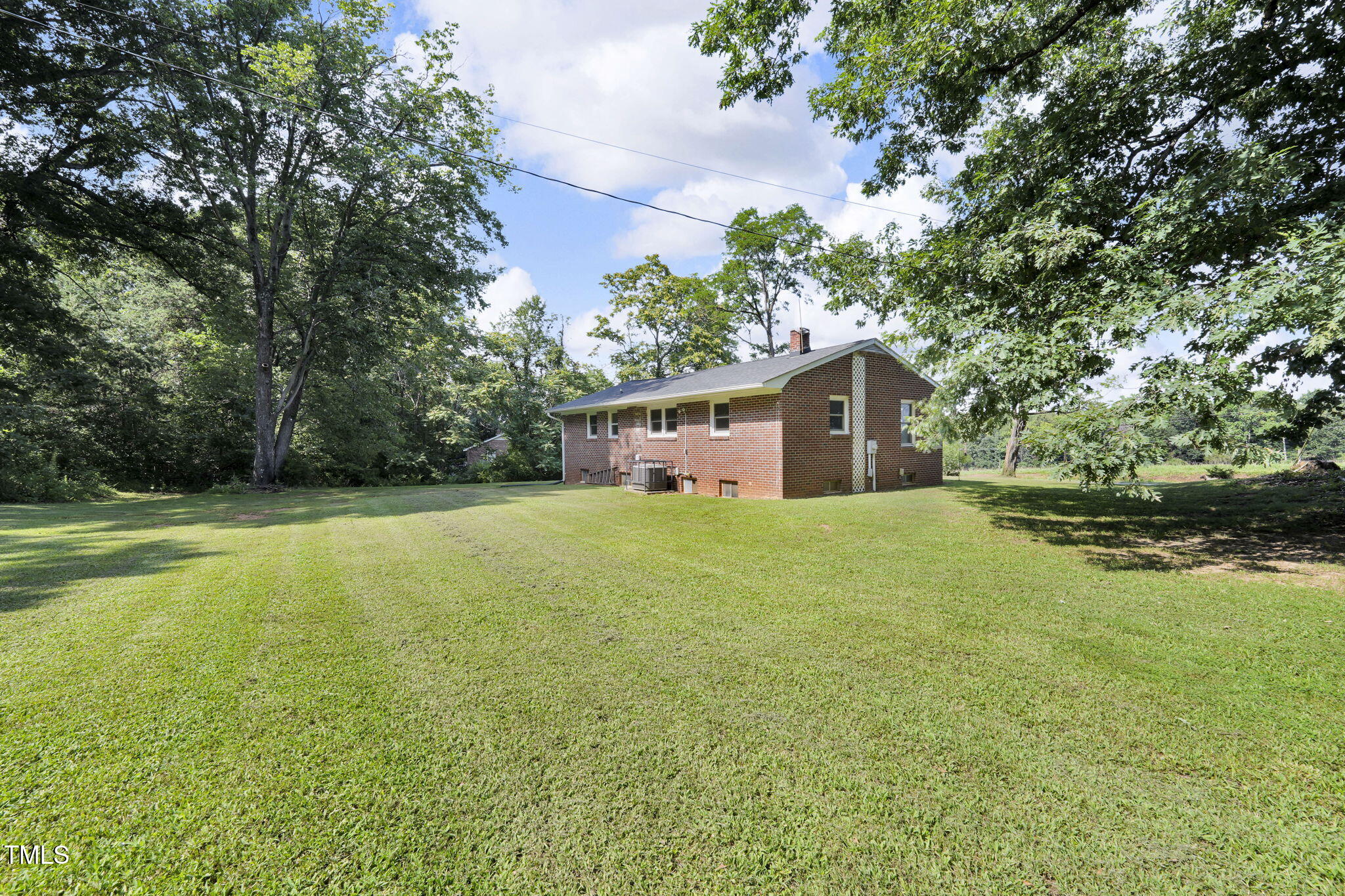 483 Allison Road Ruffin, NC 27326 - Photo 32 of 36 a house with trees in the background