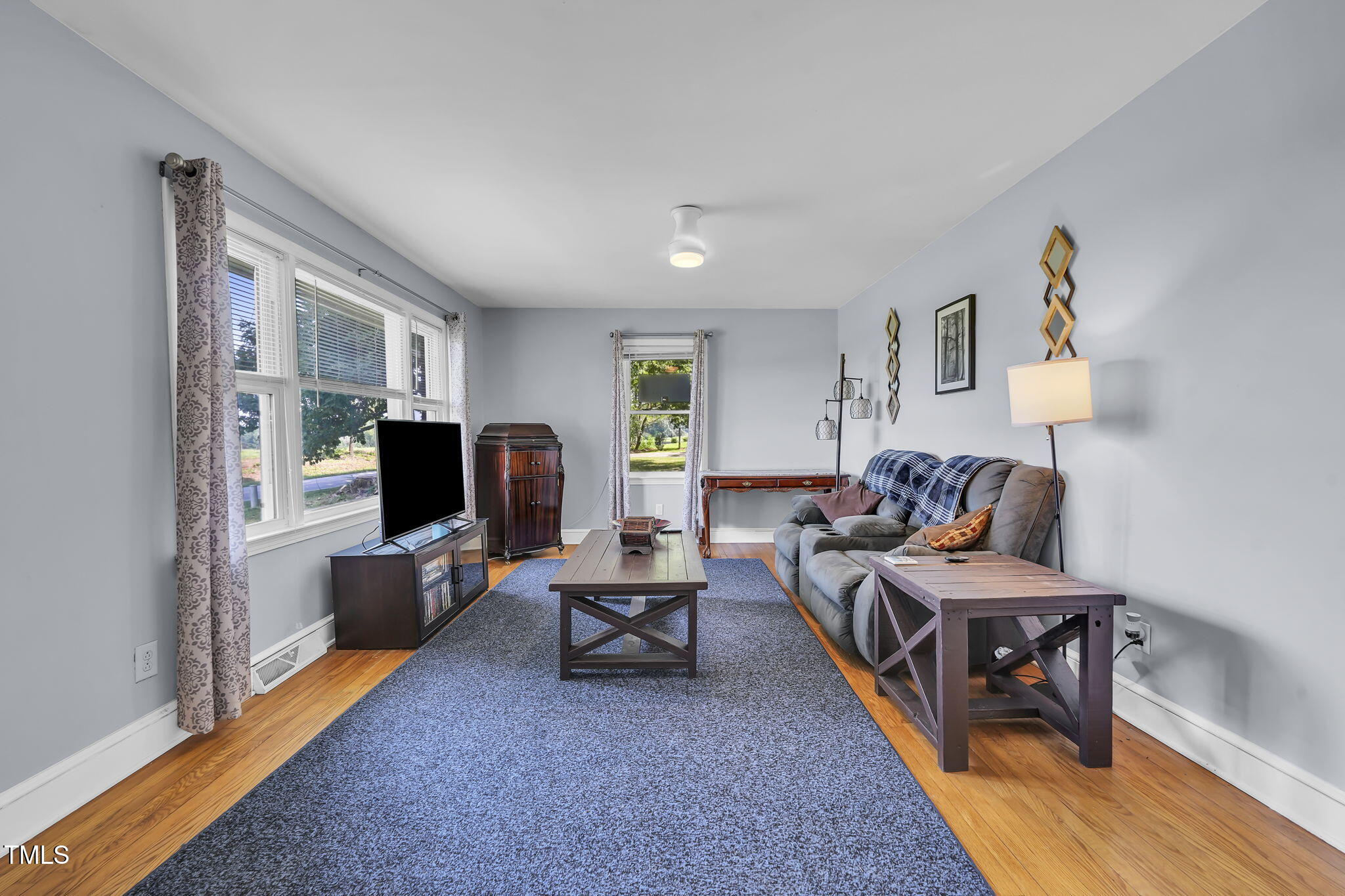 483 Allison Road Ruffin, NC 27326 - Photo 2 of 36 a living room with furniture and a flat screen tv