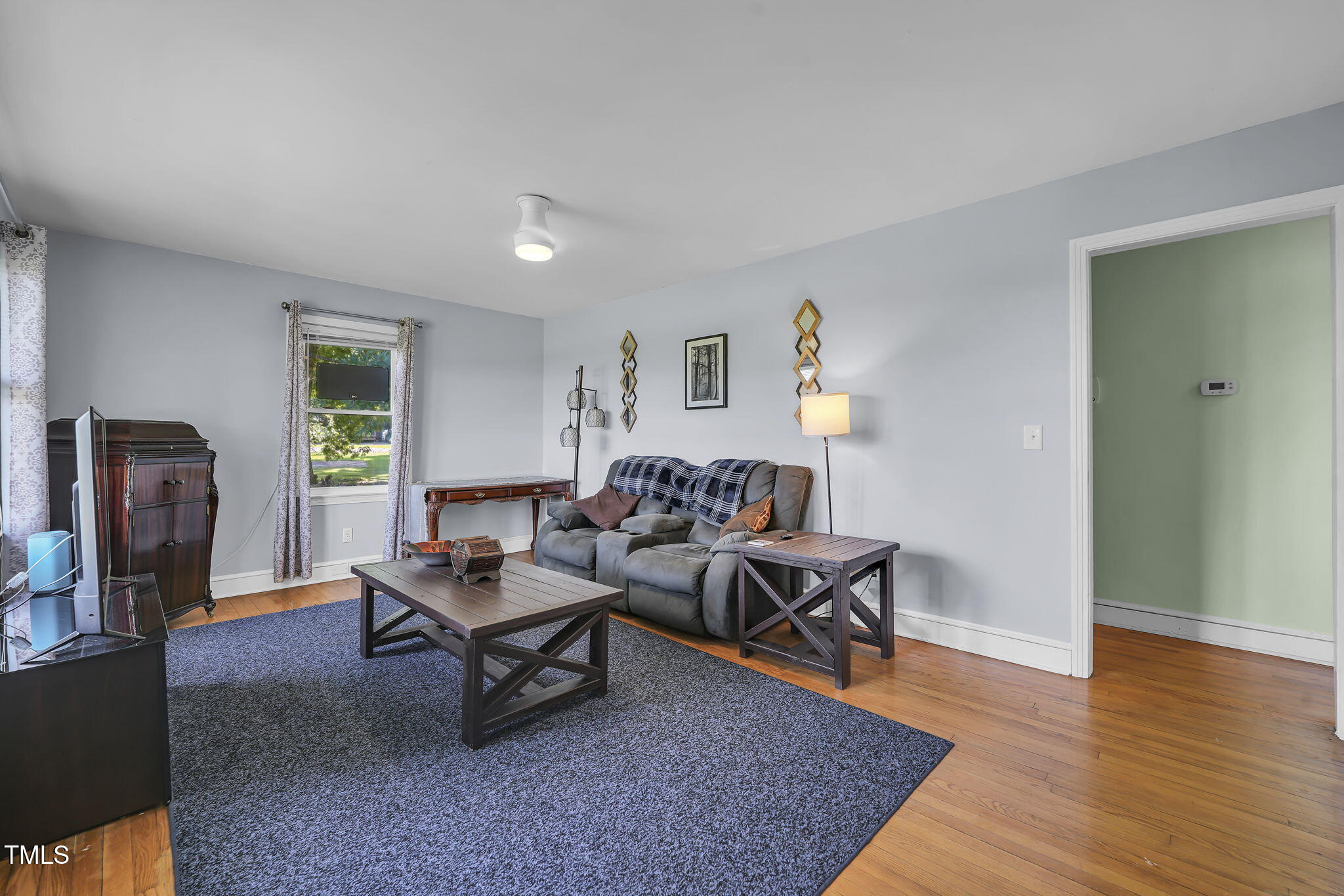 483 Allison Road Ruffin, NC 27326 - Photo 3 of 36 a living room with furniture and a wooden floor