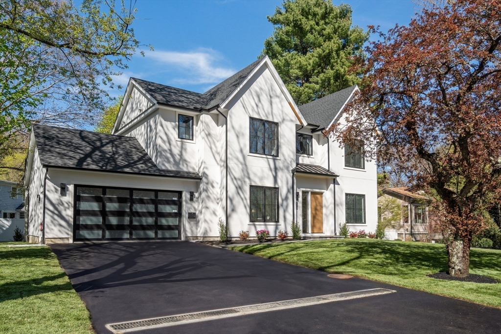 470 Quinobequin Road Newton, MA 02468 - Photo 2 of 37 a front view of a house with a garden