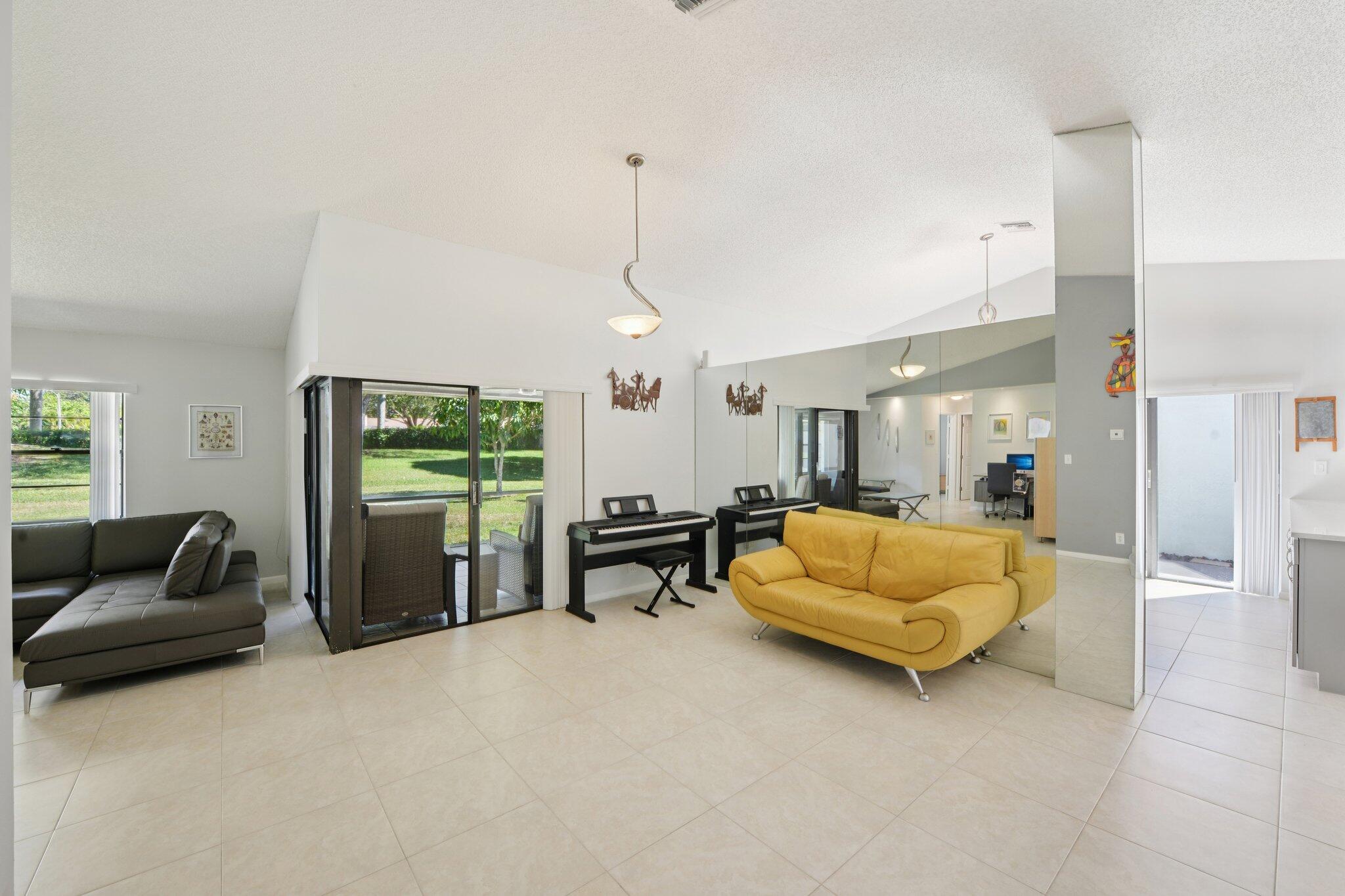 21024 Country Creek Drive Boca Raton, FL 33428 - Photo 11 of 59 a living room with furniture and a couch