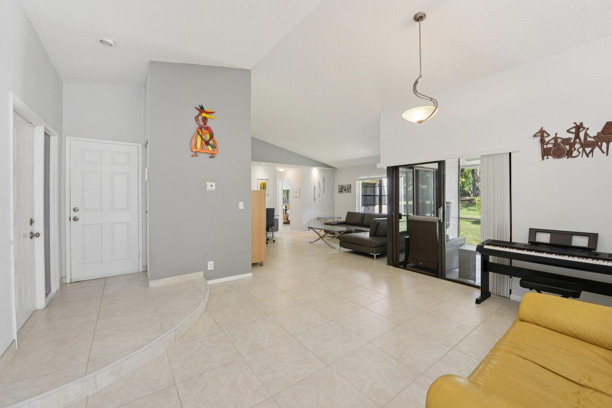 21024 Country Creek Drive Boca Raton, FL 33428 - Photo 12 of 59 a view of a livingroom with furniture and a flat screen tv