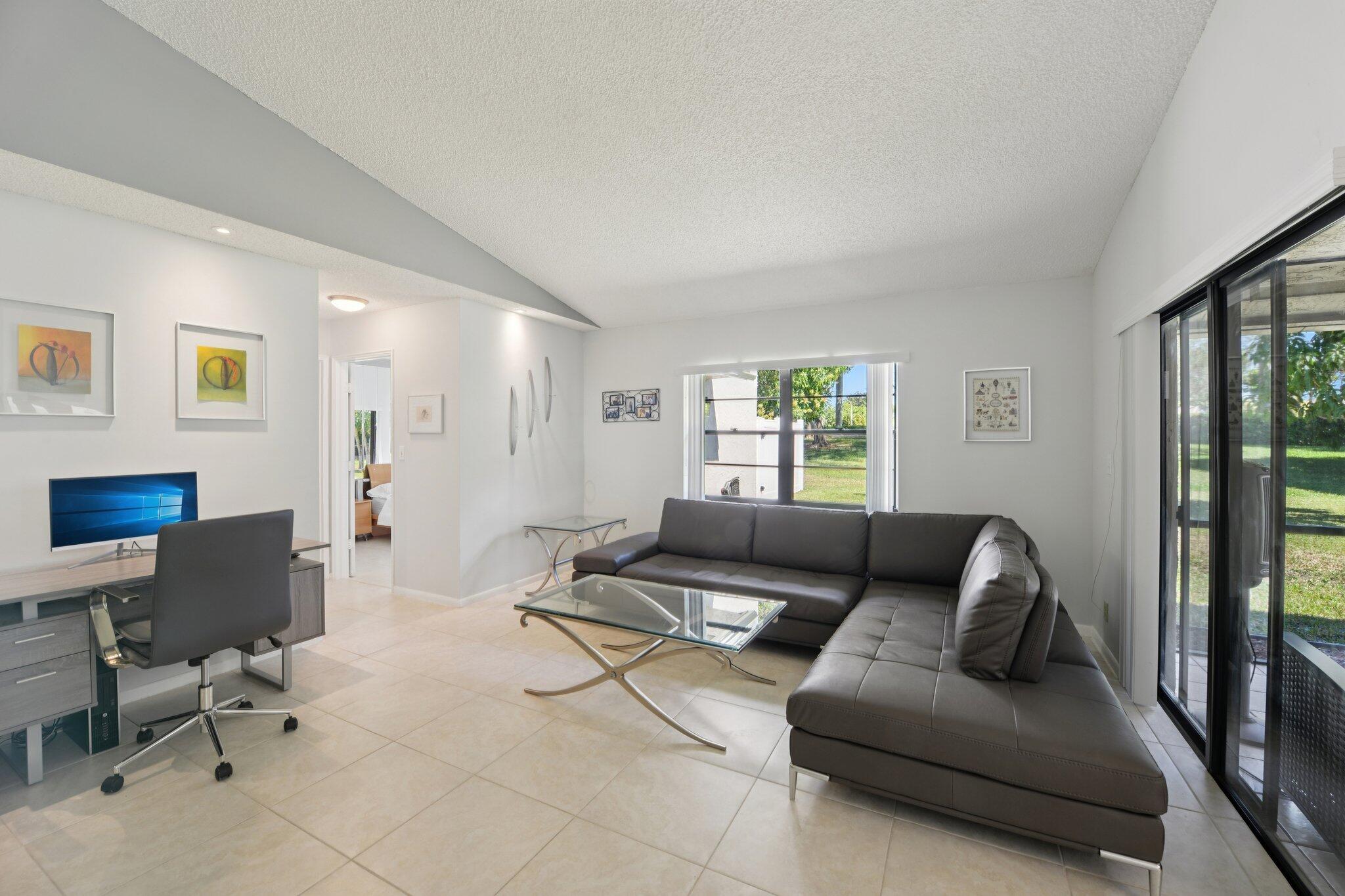 21024 Country Creek Drive Boca Raton, FL 33428 - Photo 14 of 59 a living room with furniture and a window
