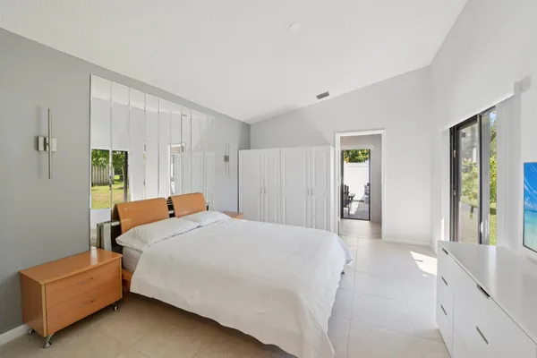 a spacious bathroom with a double vanity sink and a large mirror