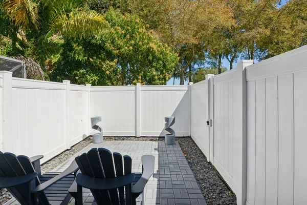 a view of a workspace with furniture and a gate