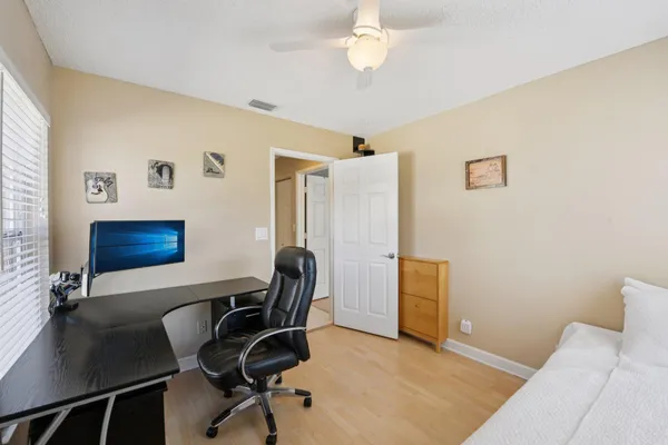 a view of a livingroom with furniture and a window