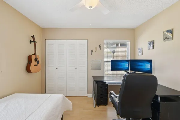 a bedroom with a bed and cabinets