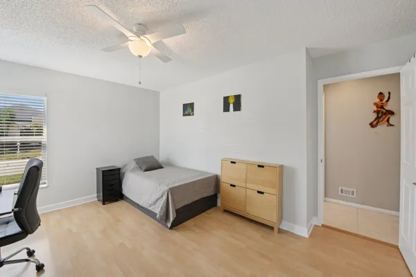 a view of a backyard with a garden and entertaining space