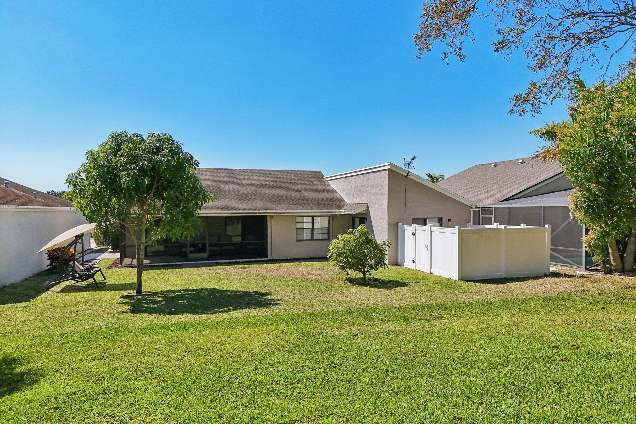21024 Country Creek Drive Boca Raton, FL 33428 - Photo 37 of 59 a view of a house with a yard and a tree