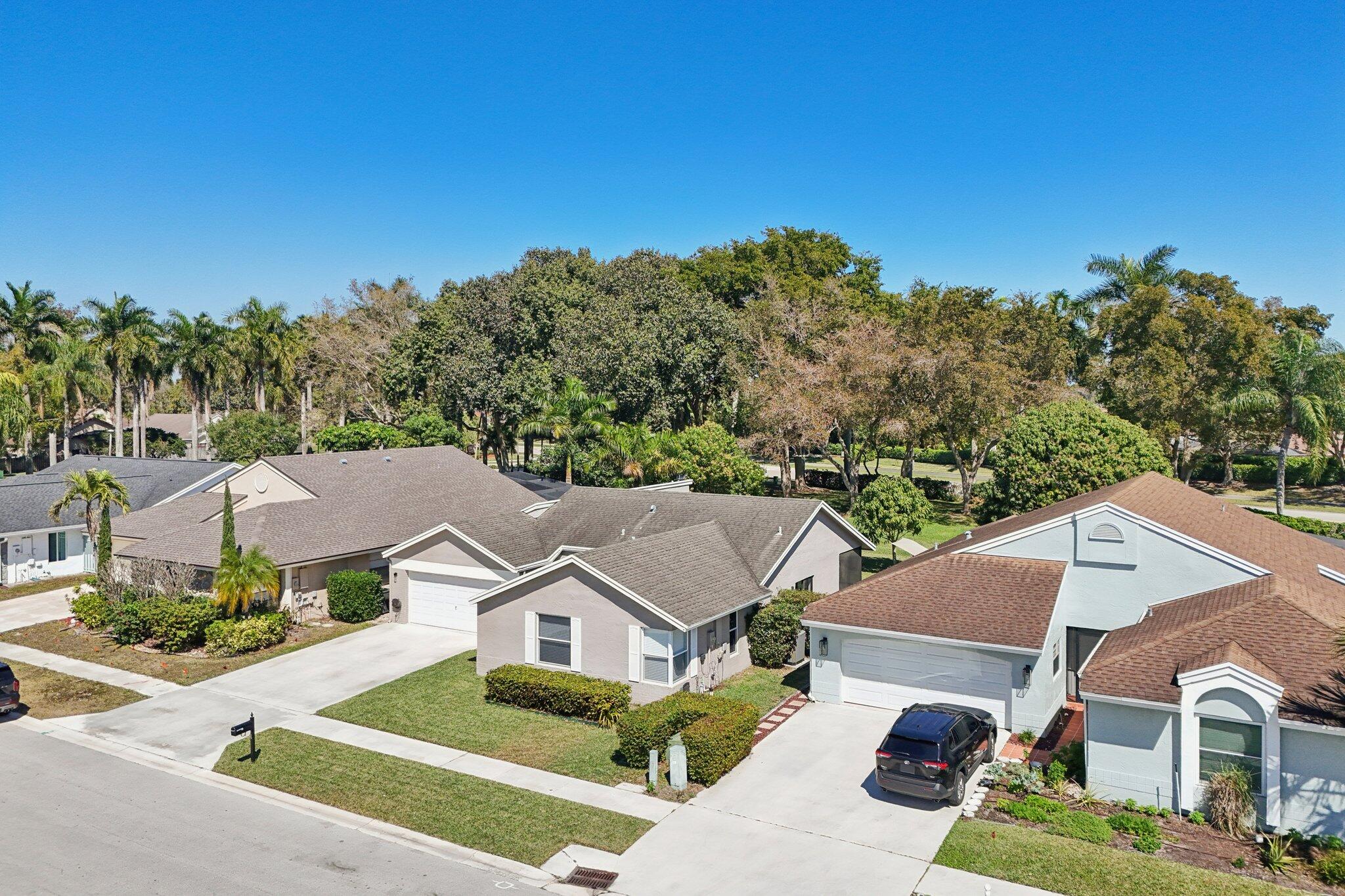 21024 Country Creek Drive Boca Raton, FL 33428 - Photo 43 of 59 an aerial view of residential houses with outdoor space and trees